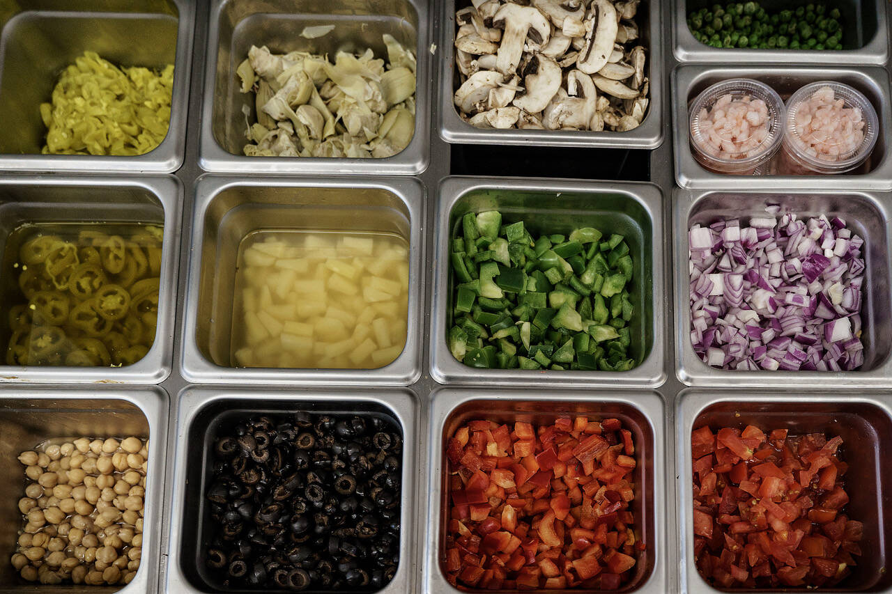 There are toppings galore at Crab ‘N Go, including smoked salmon, shrimp and cashews. (Photo by David Welton)