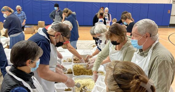 Photo provided
Volunteers for Mobile Turkey Unit assemble Thanksgiving meals.