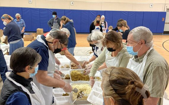 Photo provided
Volunteers for Mobile Turkey Unit assemble Thanksgiving meals.