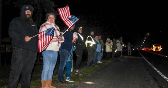 Photo by Sam Fletcher 
Members of the Oak Harbor community show support during the procession of Lt. Serena “Dug” Wileman on Monday.