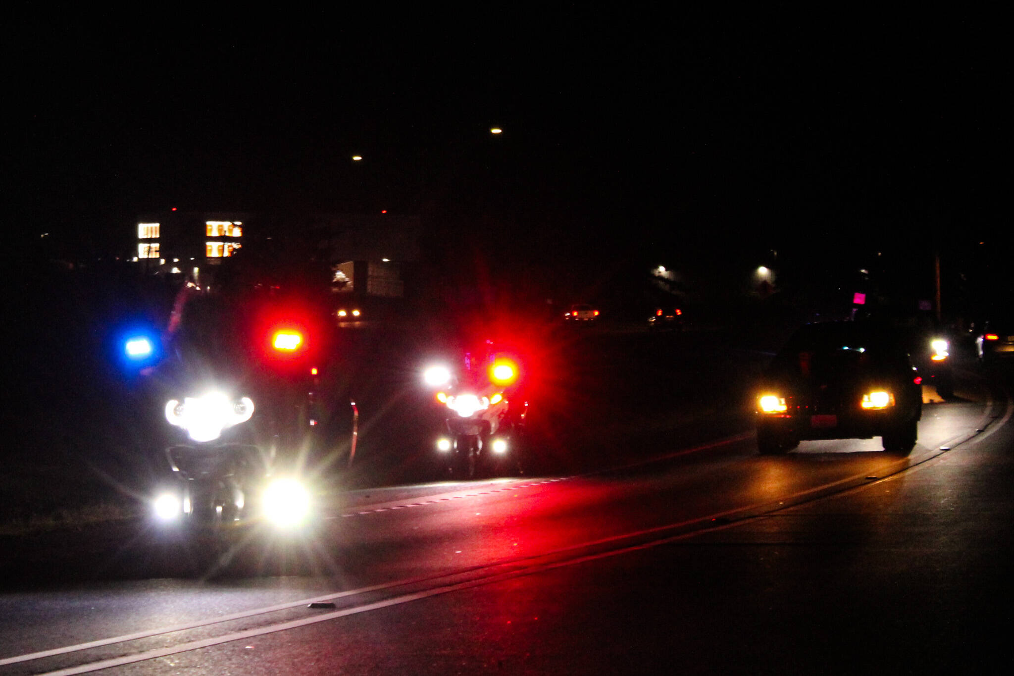 Police escort the hearse carrying Lt. Serena “Dug” Wileman, one of the two aviators lost in the Oct. 15 EA-18G Growler crash during routine training near Mount Rainier, as she returned home from Dover Air Force Base on Monday. (Photo by Sam Fletcher)