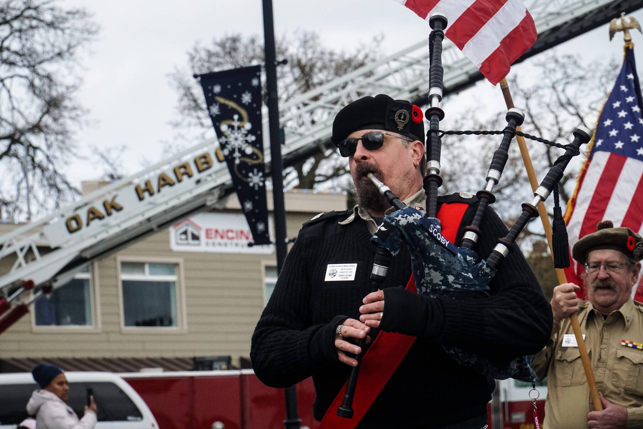 Photo by Sam Fletcher
Don Scoby, commander of Scottish American Military Society Pig War Post 1859, plays the bagpipe at the Veterans Day Parade in Oak Harbor.