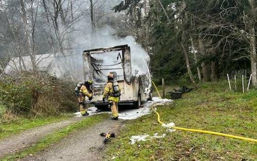 (Photo provided)
Firefighters respond to a blazing delivery truck late Wednesday morning.