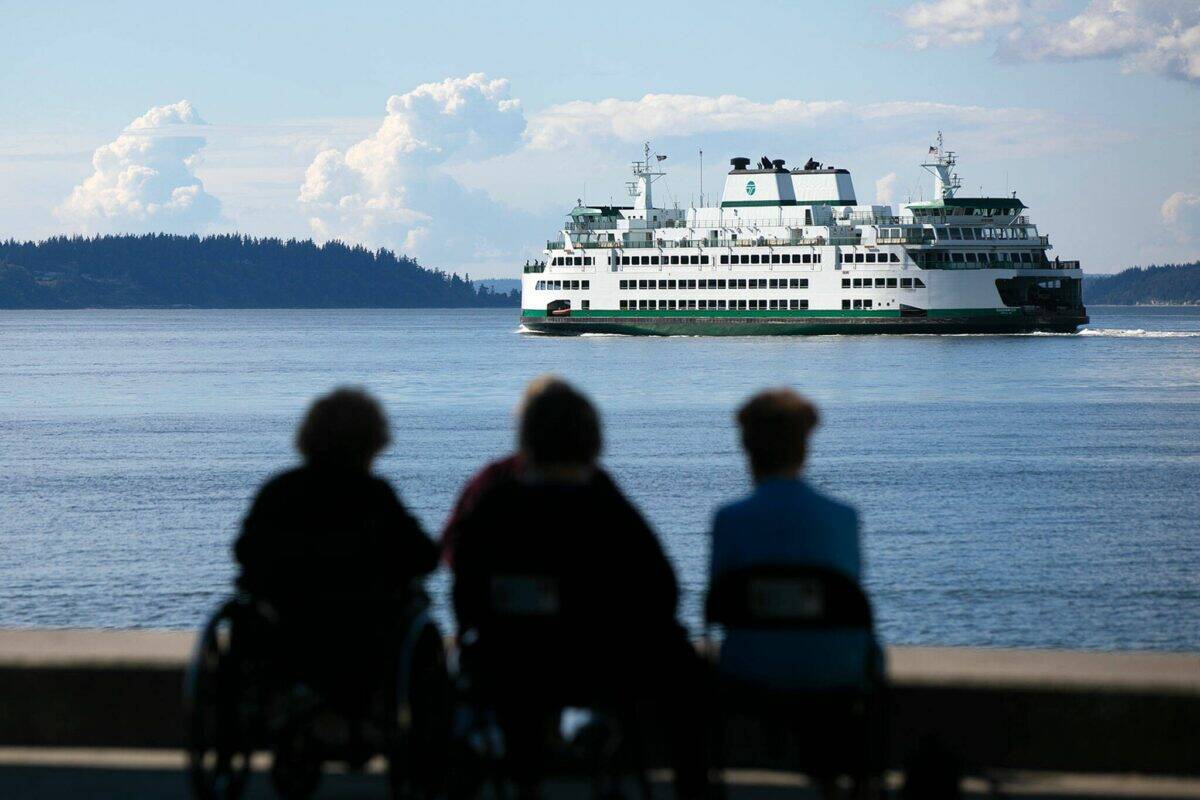 A ferry heads out from Mukilteo toward Clinton during the evening commute in 2022.
(Ryan Berry / The Everett Herald)