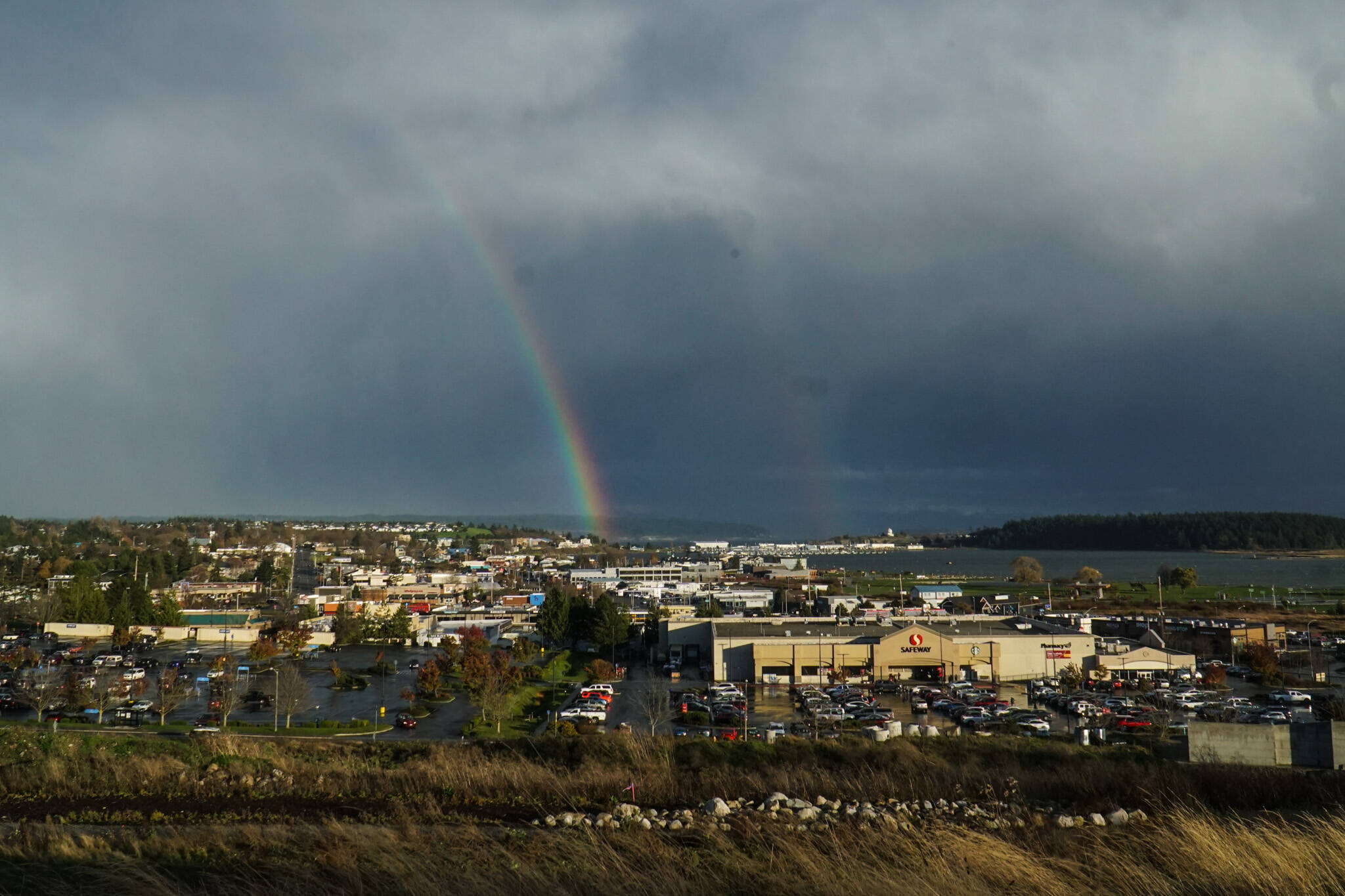 Photo by Sam Fletcher
A double rainbow arches over a housing development in Oak Harbor on Friday.