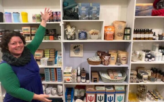 Emily Wilder prepares items at the new shop, Salinity at the Bard’s Boutique at Bayview Corner, which opens on Sunday, Dec. 1.