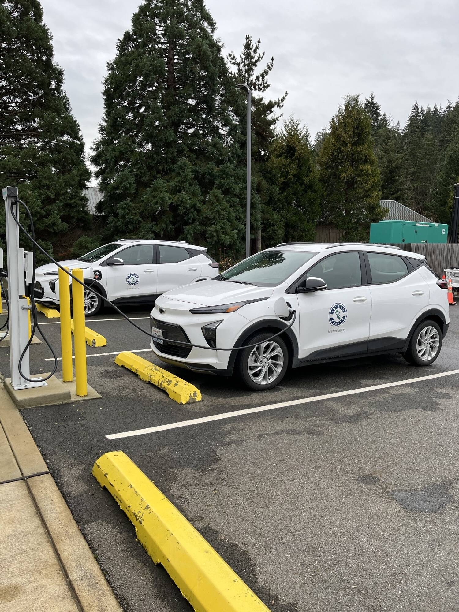 (Photo provided)
Level 2 electric vehicle charging stations power up Island County vehicles outside of the Camano Island administration building.