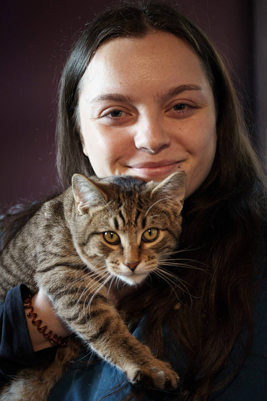 (Photo by David Welton)
Animal Care Technician Sam Thomson cuddles with Thorin.