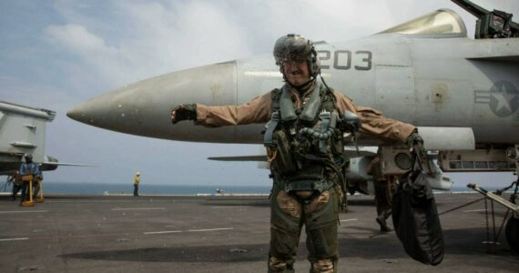 A U.S. Navy officer, assigned to Strike Fighter Squadron (VFA) 14, celebrates a change of command aboard the Nimitz-class aircraft carrier USS Abraham Lincoln (CVN 72). (Courtesy photo)